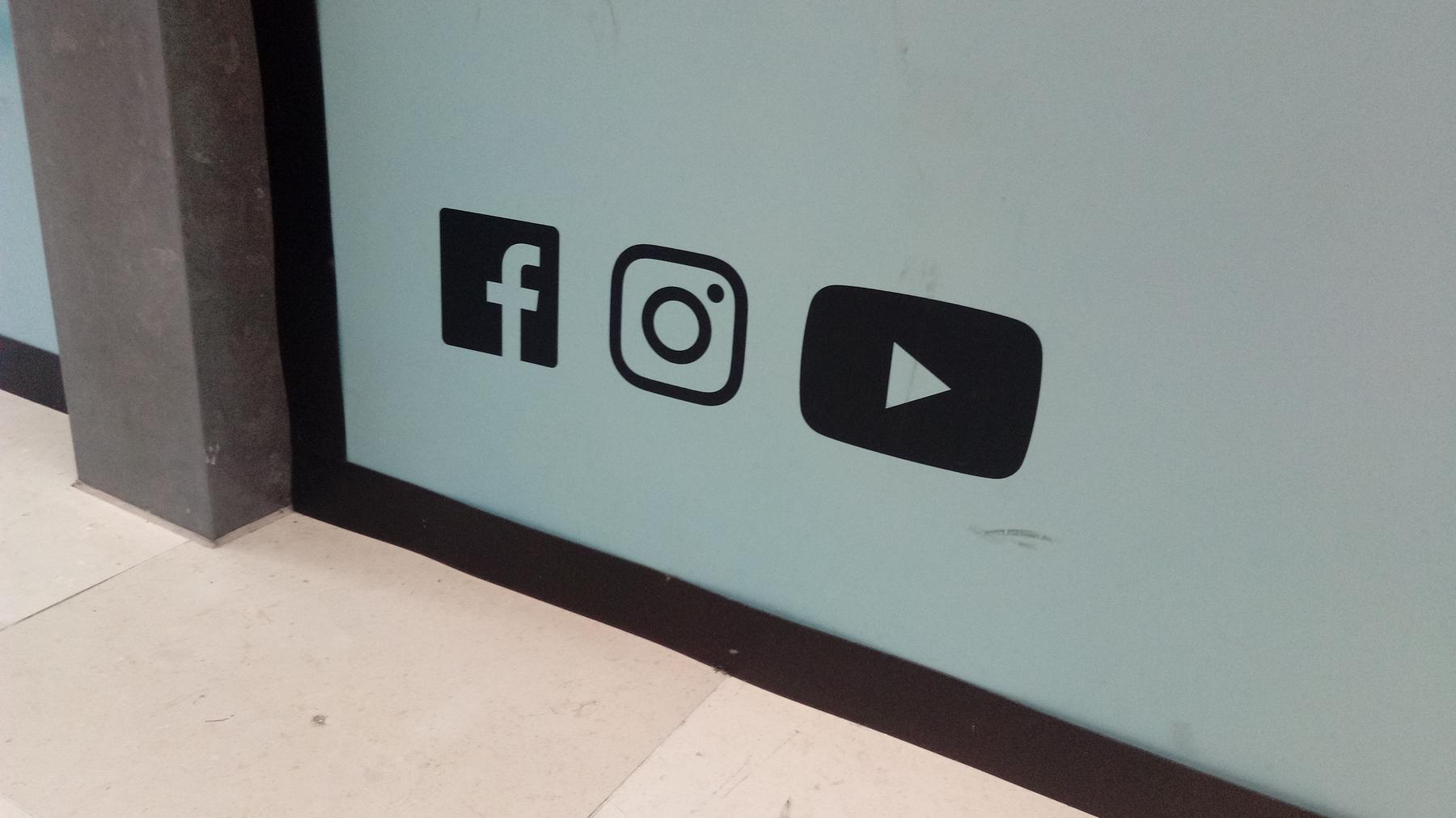 Facebook, Instagram, and YouTube logo's, Utrecht (2019) 01 - a sign that says,'off the door ' Facebook, Instagram, and YouTube logo's, Utrecht (2019) 01 - a sign that says,'off the door '